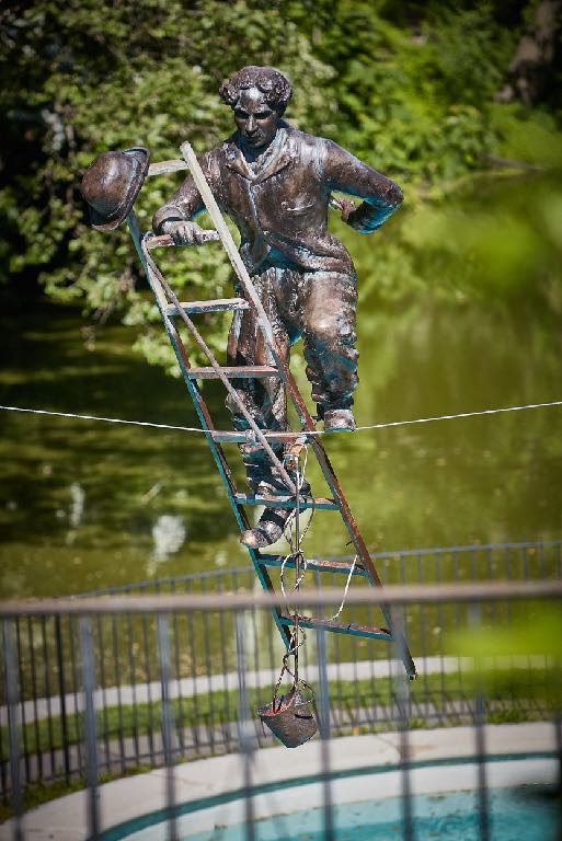 Charlie Chaplin With Ladder by Jerzy Kędziora at Old Westbury Gardens